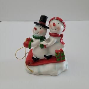 Festive Snowman Figurine on Sled with Gift Decoration 3.5x3 inches